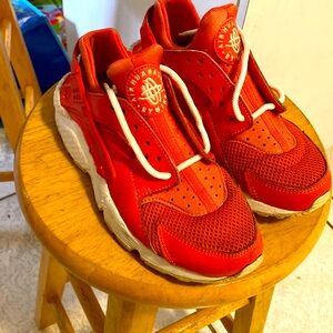 Nike Air Huarache coral and white athletic sports shoes